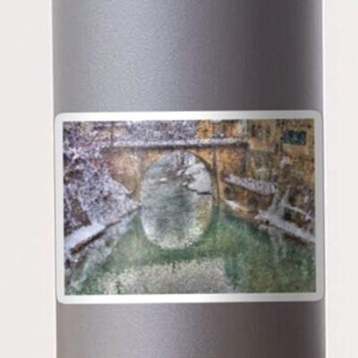 Snowy Stone Bridge Over Water